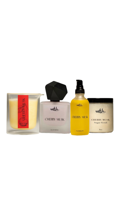 Collection of Cherry Musk products including a candle, soap, and spray bottle on a white background.