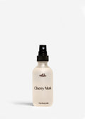 Body mist bottle labeled 'Cherry Musk' on a white background