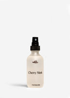 Body mist bottle labeled 'Cherry Musk' on a white background