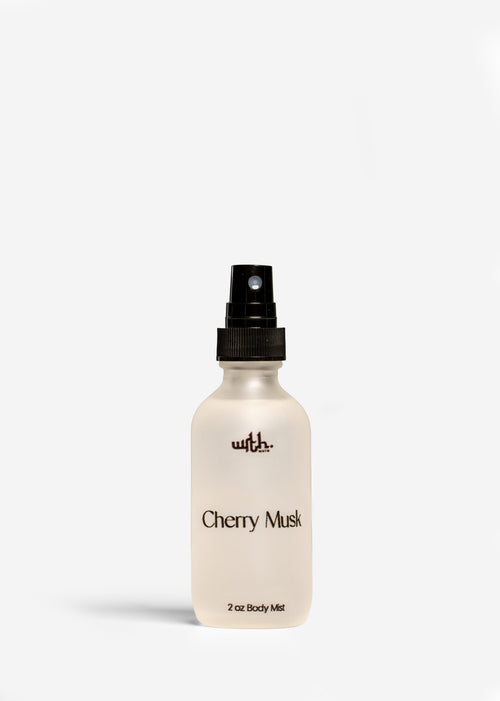 Body mist bottle labeled 'Cherry Musk' on a white background