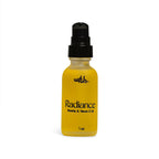 Yellow bottle of Radiance Niacin & Vitamin E Oil with black cap on a white background