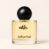 WRTH Saffron Noir Eau de Parfum, 1.7 oz clear glass bottle with a matte black spherical cap on a warm cream background