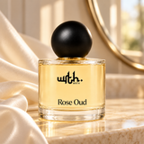 WRTH Rose Oud Eau de Parfum on a marble surface with draped cream satin