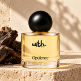 WRTH Opulence Eau de Parfum on a travertine stone block beside a piece of agarwood in warm sunlight
