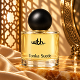 WRTH Tonka Suede Eau de Parfum on polished marble draped with gold satin, with a gold lattice screen behind
