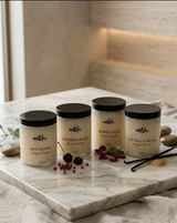 Four containers of 'wrth' body scrubs on a marble tray with a neutral background