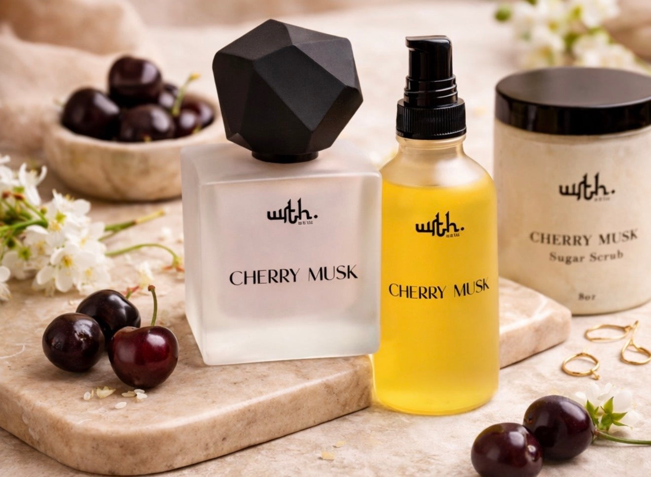 Cherry Musk fragrance and skincare products on a marble surface with cherries and flowers.