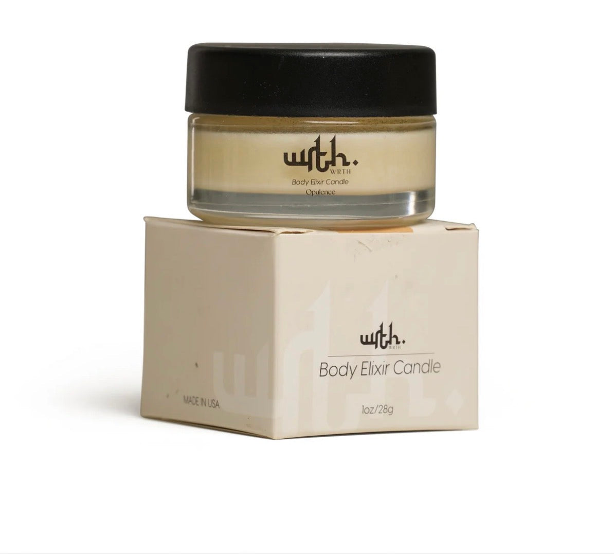 Body elixir candle with black lid and beige container on a white background