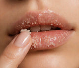 Close-up of lips with a sugar scrub being applied