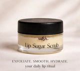 Jar of lip sugar scrub with a black lid on a light background