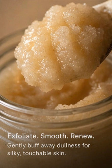 Jar of exfoliating scrub with a spoonful above, labeled 'Exfoliate. Smooth. Renew.'