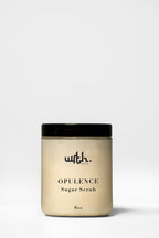 Jar of opulence sugar scrub with a black lid on a white background