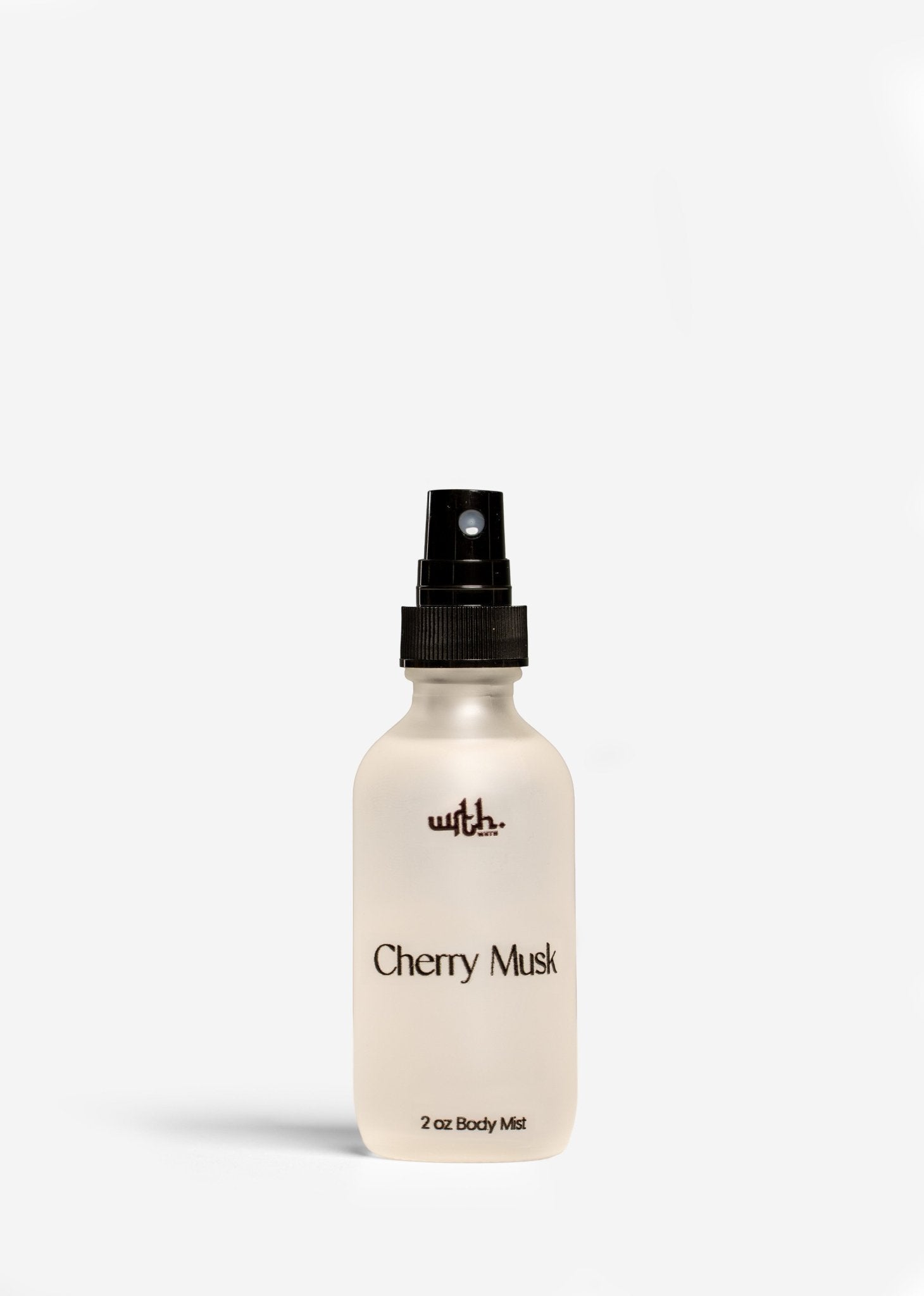 2 oz frosted glass bottle of Cherry Musk body mist with black spray top by Wrth on white background