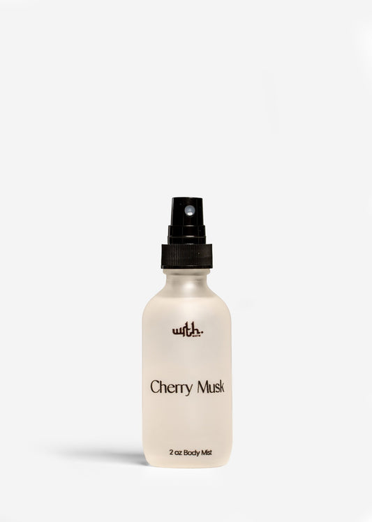 2 oz frosted glass bottle of Cherry Musk body mist with black spray top by Wrth on white background