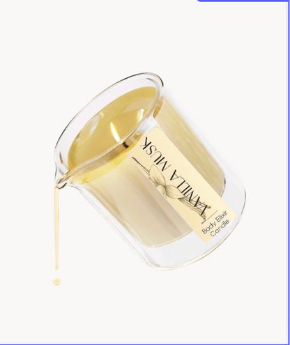 Clear glass beaker pouring warm vanilla musk body elixir candle oil with beige label