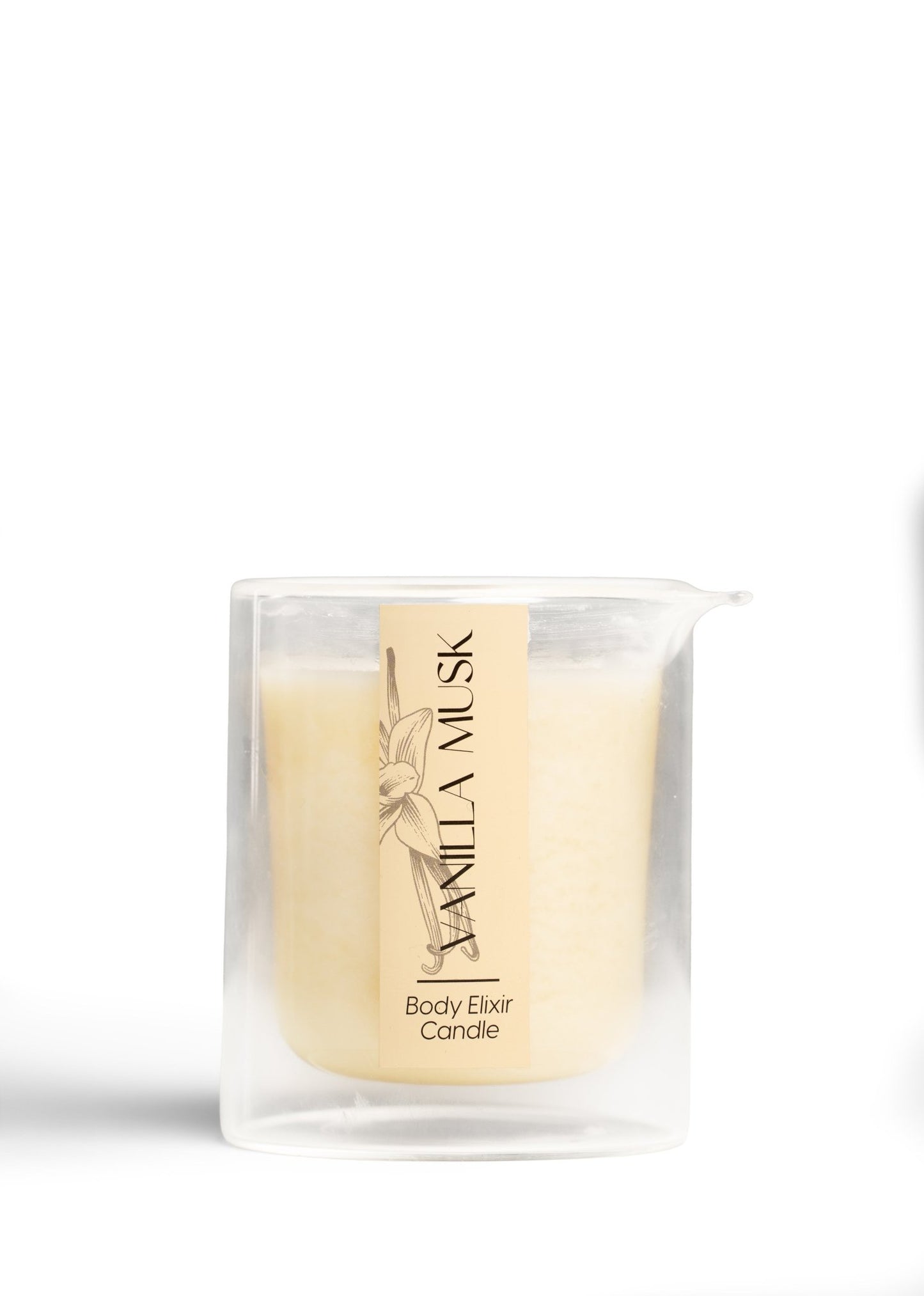 Vanilla Musk Body Elixir Candle in clear glass container with beige label featuring floral design
