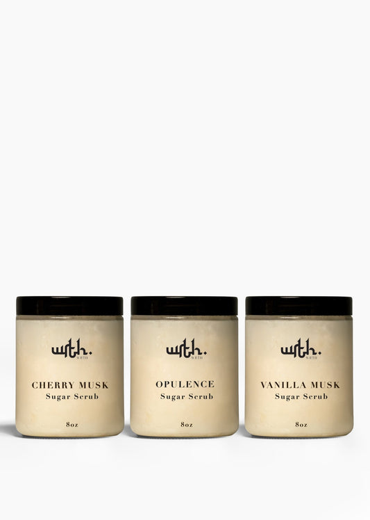 Three 8oz WRTII sugar scrub jars labeled Cherry Musk, Opulence, and Vanilla Musk in minimalist design
