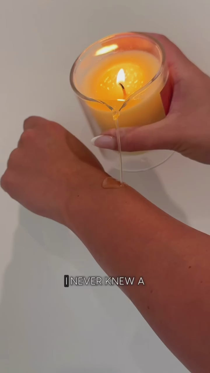 Body elixir candle being used after shower 